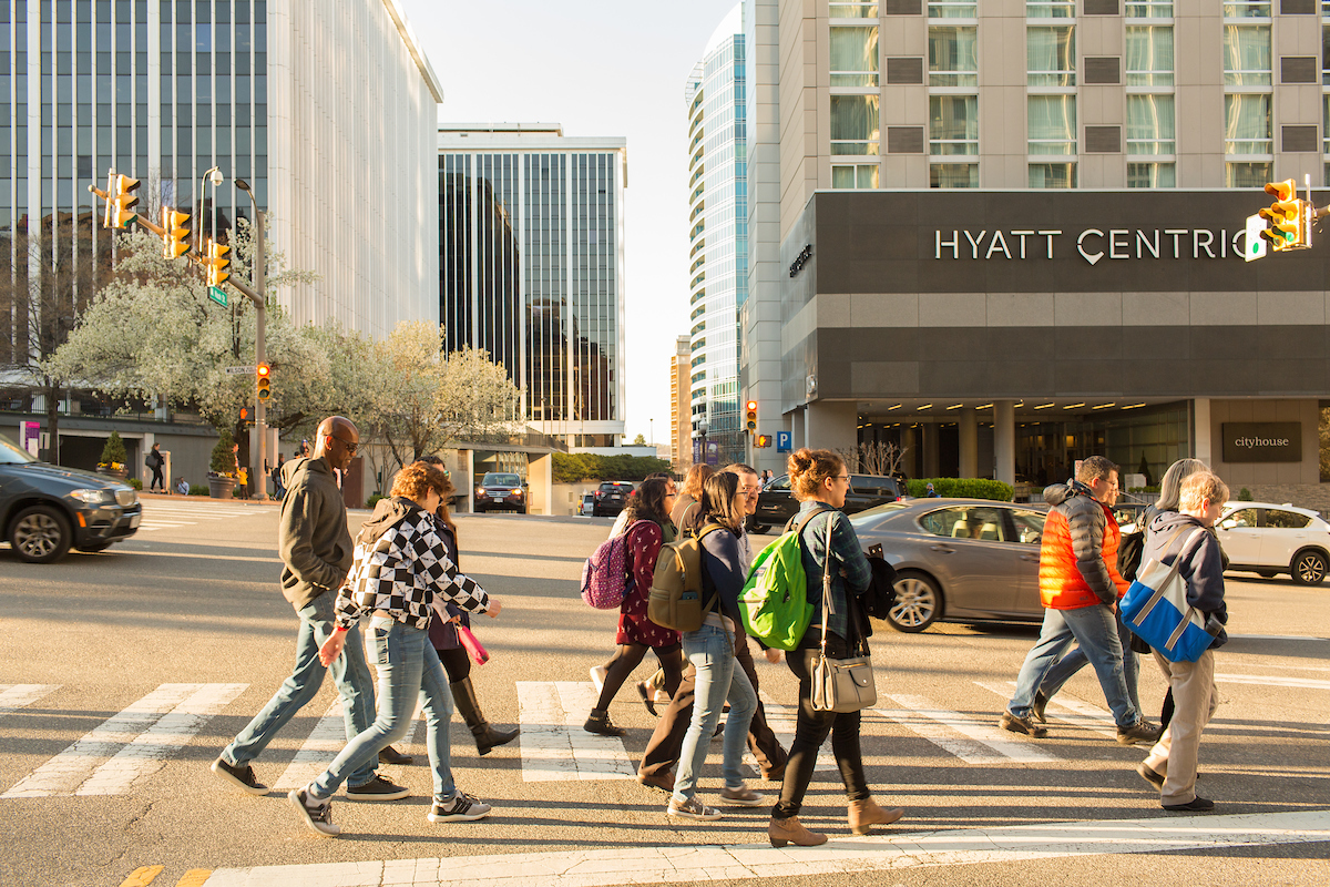 Group of people walking in a crosswalk on a cool-weather day in Rosslyn, Arlington, VA